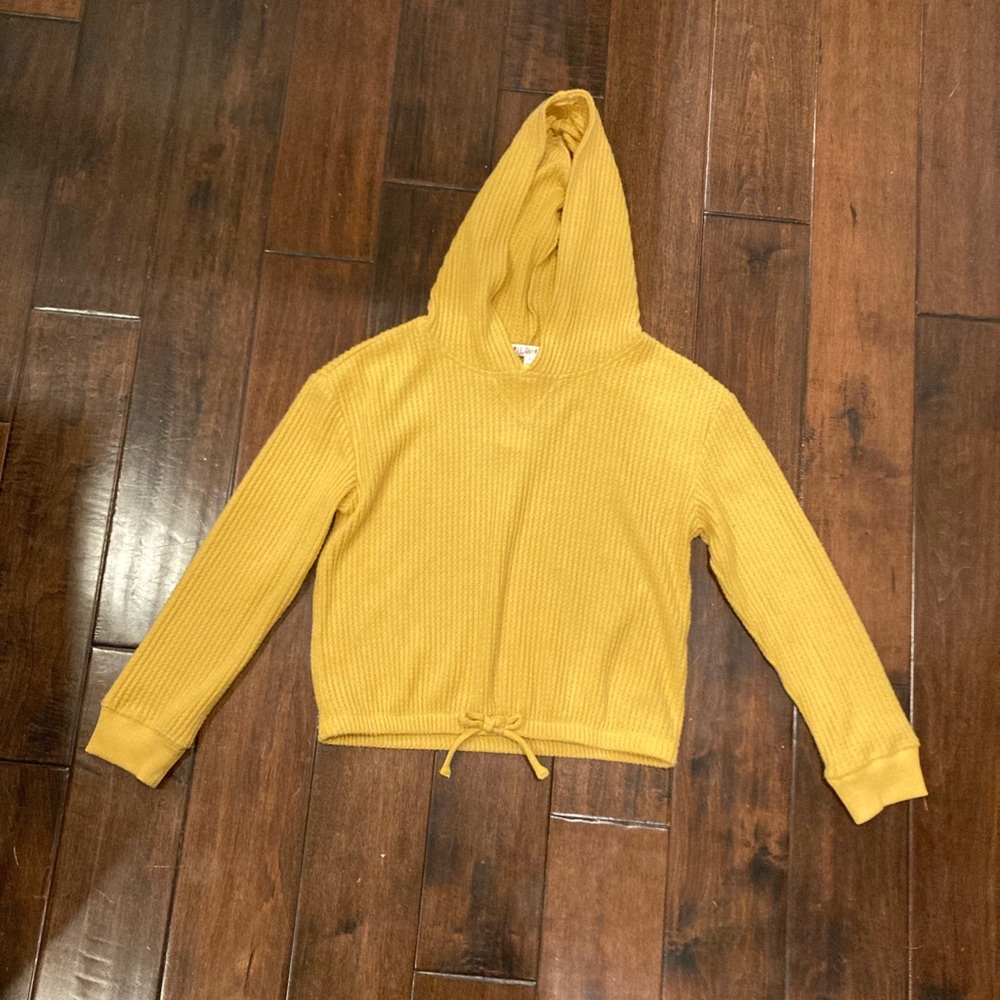 A cropped pull over hoodie